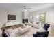 Bright living room features a fireplace, white sofas with blue pillows, and sliding glass door to the outside at 2333 Tall Sail Dr # G 607, Charleston, SC 29414