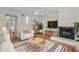 Bright living room featuring fireplace, wood floors, and contemporary furnishings at 2333 Tall Sail Dr # G 607, Charleston, SC 29414