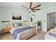 Main bedroom features modern decor, a ceiling fan, and a view to an en-suite bathroom at 2333 Tall Sail Dr # G 607, Charleston, SC 29414