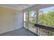 Enclosed porch features an exterior door, and windows with views of the marsh and maritime forest at 2333 Tall Sail Dr # G 607, Charleston, SC 29414