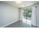 Bedroom with backyard view, light gray walls, laminate flooring, and white curtains at 235 Pine Shadow Dr, Goose Creek, SC 29445