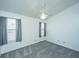 Bright bedroom featuring carpet, ceiling fan, and two windows at 235 Pine Shadow Dr, Goose Creek, SC 29445
