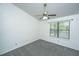 Cozy bedroom with ceiling fan and large window providing natural light at 235 Pine Shadow Dr, Goose Creek, SC 29445