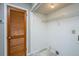 Convenient laundry area features built-in shelving and a louvered door at 235 Pine Shadow Dr, Goose Creek, SC 29445
