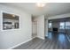 Open living room showcasing sightlines into the kitchen and featuring modern laminate flooring at 235 Pine Shadow Dr, Goose Creek, SC 29445