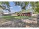 A spacious backyard with a patio offers a serene outdoor living space for relaxation and entertaining at 25 Aldene Ave, Goose Creek, SC 29445