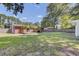A spacious backyard with a charming patio offers a serene outdoor living space for relaxation and entertaining at 25 Aldene Ave, Goose Creek, SC 29445