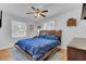 Bright primary bedroom with a ceiling fan, natural light, and wood floors at 25 Aldene Ave, Goose Creek, SC 29445