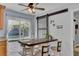 Bright dining area with a sliding glass door to the patio, accented by a modern sliding barn door at 25 Aldene Ave, Goose Creek, SC 29445