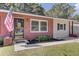Charming single-story brick home with a well-manicured lawn and stylish front entrance at 25 Aldene Ave, Goose Creek, SC 29445