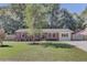 Charming single-story brick home with a well-manicured front lawn and landscaping at 25 Aldene Ave, Goose Creek, SC 29445