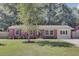 Charming single-story brick home with a well-manicured lawn and mature tree in the front yard at 25 Aldene Ave, Goose Creek, SC 29445