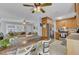 Open-concept kitchen showcasing a breakfast bar, stainless steel appliances, and seamless integration with the living area at 25 Aldene Ave, Goose Creek, SC 29445