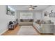 Bright living room featuring hardwood floors, plush sofas, and a ceiling fan at 25 Aldene Ave, Goose Creek, SC 29445