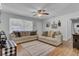 Bright living room featuring hardwood floors, plush sofas, and a ceiling fan at 25 Aldene Ave, Goose Creek, SC 29445