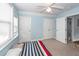 Charming bedroom with blue walls, neutral carpet, and two closets at 2613 Rivertowne Pkwy, Mount Pleasant, SC 29466