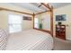 Cozy bedroom with a wooden canopy bed, neutral tones, and comfortable ambiance at 2613 Rivertowne Pkwy, Mount Pleasant, SC 29466