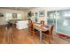 Open dining and living space with hardwood floors, ample seating, and natural light at 2613 Rivertowne Pkwy, Mount Pleasant, SC 29466