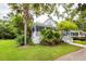 Charming two-story house with white siding, a cozy front porch, and lush landscaping at 2613 Rivertowne Pkwy, Mount Pleasant, SC 29466