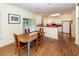 Bright kitchen and dining area with modern appliances, counter seating, and hardwood floors at 2613 Rivertowne Pkwy, Mount Pleasant, SC 29466