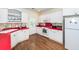 Updated kitchen featuring white cabinets, red countertops, and modern appliances at 2613 Rivertowne Pkwy, Mount Pleasant, SC 29466