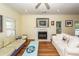 Bright living room with hardwood floors, fireplace, comfortable seating, and natural light at 2613 Rivertowne Pkwy, Mount Pleasant, SC 29466