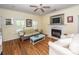 Inviting living room featuring a fireplace, hardwood floors and comfortable seating at 2613 Rivertowne Pkwy, Mount Pleasant, SC 29466