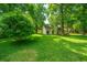 Lush backyard with mature trees and ample space for outdoor activities at 2650 Summer Leaves Ct, Charleston, SC 29414