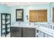 Bathroom with double vanities, granite countertops, and a view of the window at 2650 Summer Leaves Ct, Charleston, SC 29414