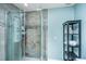 Bathroom with a walk-in tiled shower and wall shelving at 2650 Summer Leaves Ct, Charleston, SC 29414