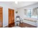Bright bedroom featuring a comfortable glider and window bench seating at 2650 Summer Leaves Ct, Charleston, SC 29414