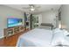A primary bedroom boasting hardwood floors, light gray walls and natural light at 2650 Summer Leaves Ct, Charleston, SC 29414