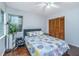 Cozy bedroom featuring a ceiling fan, hardwood floors, and a window with natural light at 2650 Summer Leaves Ct, Charleston, SC 29414