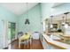 Open dining area featuring hardwood floors, a breakfast bar, and lots of natural light at 2650 Summer Leaves Ct, Charleston, SC 29414