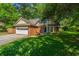 Charming two-story brick home with a well-manicured lawn and attached two car garage at 2650 Summer Leaves Ct, Charleston, SC 29414