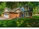 Beautiful two-story brick home with a bay window, attached garage, and lush green lawn at 2650 Summer Leaves Ct, Charleston, SC 29414