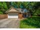Charming two-story home featuring a brick facade, a garage, and a well-manicured lawn at 2650 Summer Leaves Ct, Charleston, SC 29414