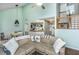 Inviting living room with vaulted ceilings, a sectional sofa, and an open concept kitchen at 2650 Summer Leaves Ct, Charleston, SC 29414