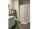 Bathroom with vanity, framed mirror, tiled floors and a shower with curtain at 305 Camellia Bloom Dr, Moncks Corner, SC 29461