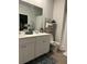 Bathroom with double sink vanity, framed mirror, tiled floors and a shower with curtain at 305 Camellia Bloom Dr, Moncks Corner, SC 29461