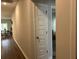 Hallway features wood floors and access to bedroom at 305 Camellia Bloom Dr, Moncks Corner, SC 29461