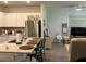 Open kitchen view to living room with stainless steel appliances and granite countertops at 305 Camellia Bloom Dr, Moncks Corner, SC 29461