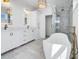 Upscale bathroom with a freestanding tub, glass shower, and dual vanity sinks at 305 Matilda St, Edisto Beach, SC 29438