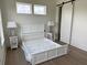 Cozy bedroom with hardwood floors, barn door, and ample natural light at 305 Matilda St, Edisto Beach, SC 29438