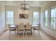 Dining room features a modern light fixture and seating for six, perfect for gatherings at 305 Matilda St, Edisto Beach, SC 29438
