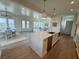 Open kitchen features a large island, sink, modern appliances, with easy access to dining and living at 305 Matilda St, Edisto Beach, SC 29438