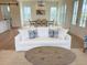 Comfortable living room with sofa, dining table and barn door at 305 Matilda St, Edisto Beach, SC 29438