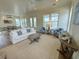 Spacious living room featuring stylish furnishings, a neutral color palette, and hardwood floors at 305 Matilda St, Edisto Beach, SC 29438