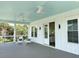 Inviting porch with chairs, fan, and a view at 305 Matilda St, Edisto Beach, SC 29438