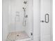 Modern shower with white tile and glass enclosure at 305 Matilda St, Edisto Beach, SC 29438